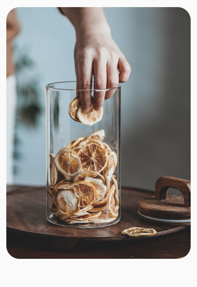 Japanese-inspired kitchen storage solution showing transparent glass body and handcrafted wooden lid