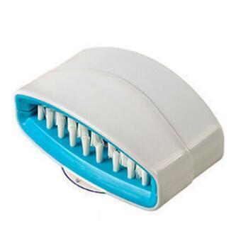 Innovative alligator kitchen scrub brush demonstrating dual-sided cleaning surface with durable grip handle