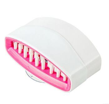 Whimsical green alligator dish scrubber displaying efficient scrubbing power with protective non-scratch design