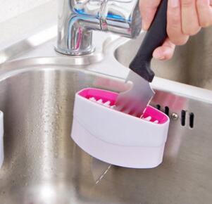 Multi-purpose alligator kitchen cleaning tool featuring flexible scrubbing head and comfortable handling