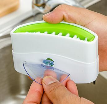 Heavy-duty alligator dish scrubber featuring specialized bristle pattern for effective kitchen cleaning