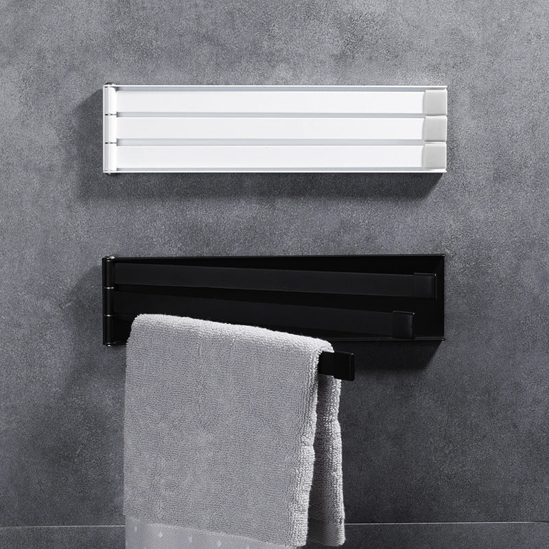Space-saving bathroom organizer featuring damage-free wall-mounted towel holder with self-adhesive backing