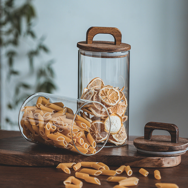 Large-volume Japanese storage jar showing clear glass construction and natural wood sealing lid