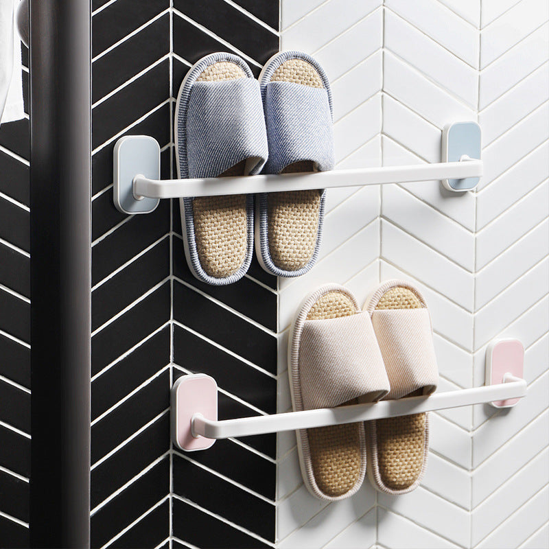 Space-saving bathroom organizer featuring adhesive mounting and drainage slots for slippers